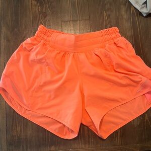 Hotty hot 4” inseams low rise shorts. Rare lululemon color:sunset. Never worn